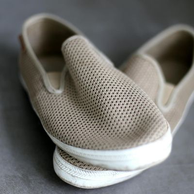 Close-up of comfortable, modern sneakers on a soft surface.